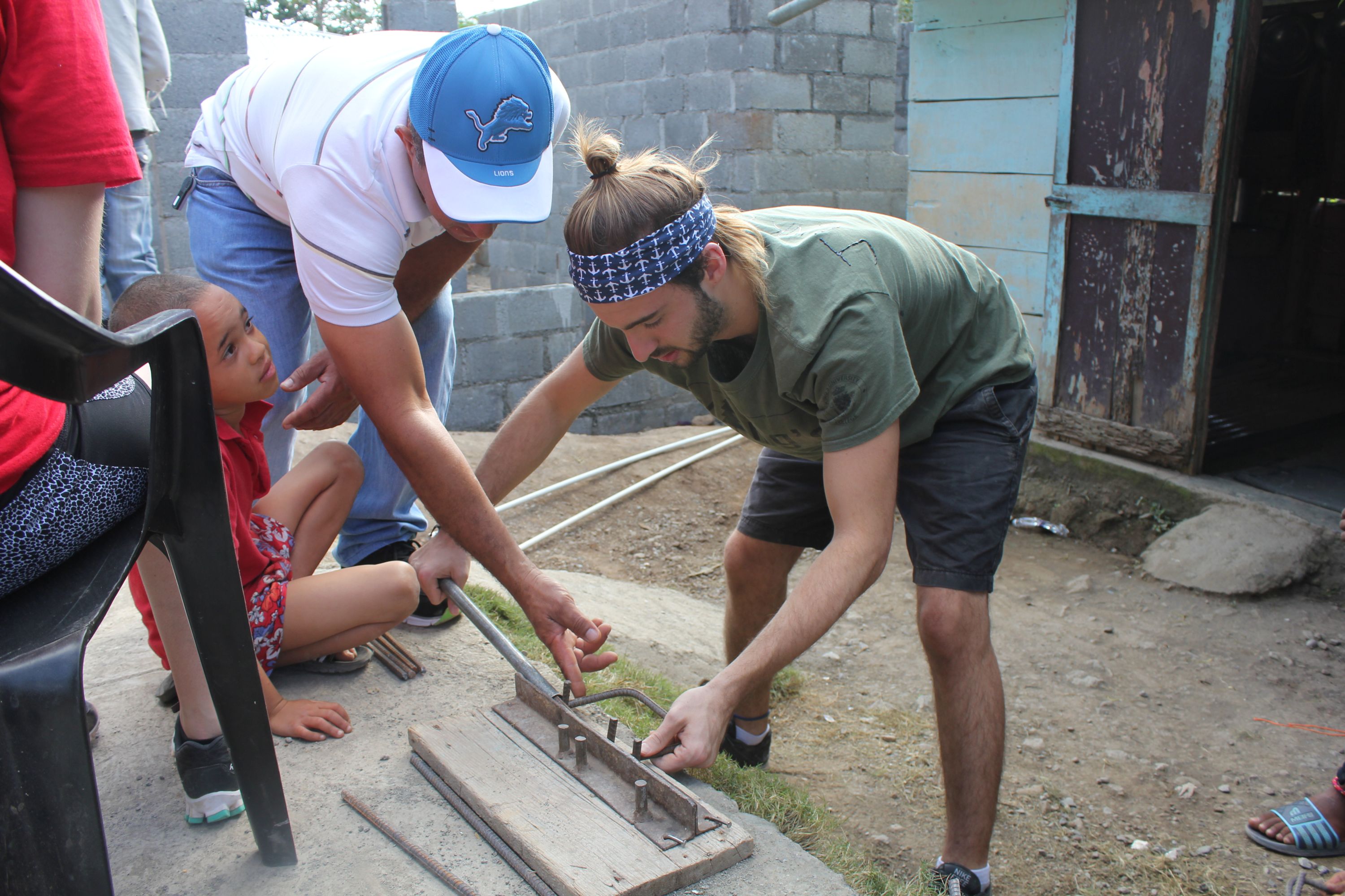 (Image: King's student helping build a home in the Dominican Republic)