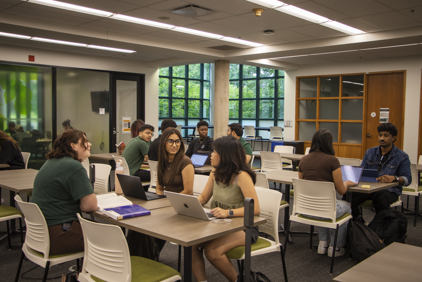 Students working together at tables in the Cardinal Carter Library